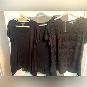 Three, size Medium black tops.